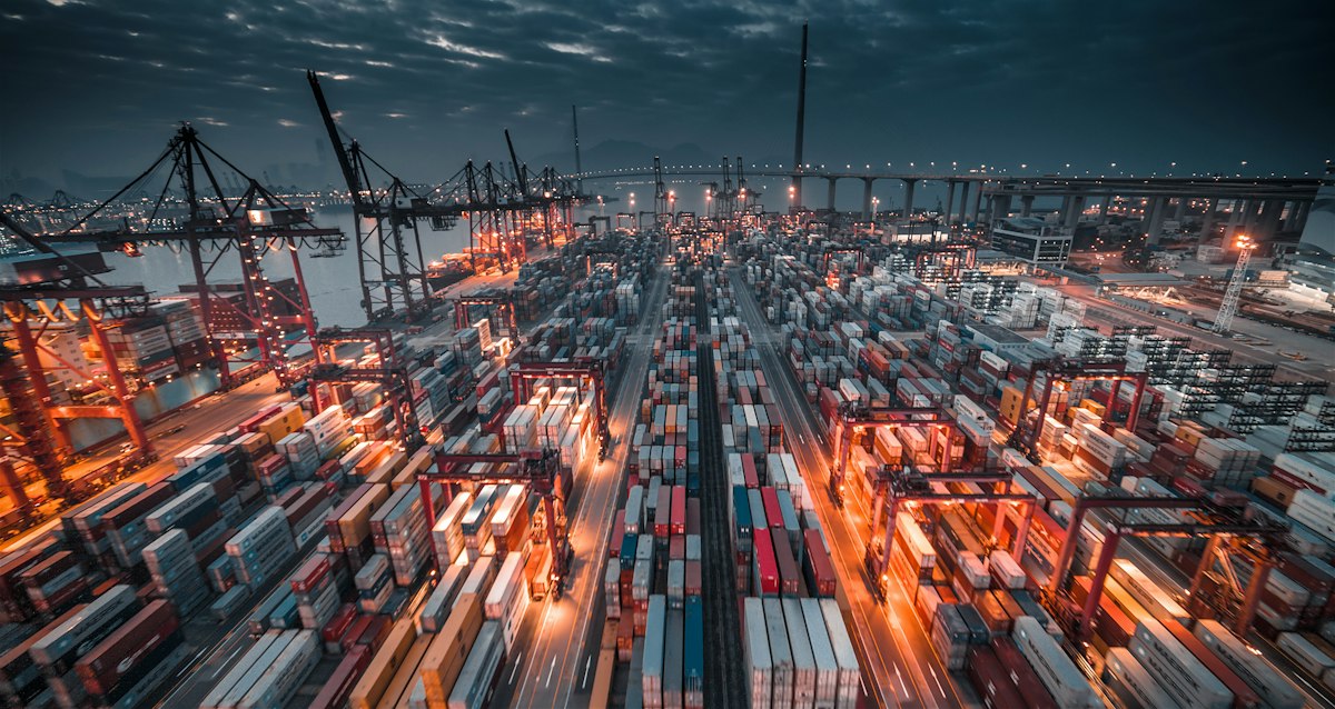 Cargo containers and vessels at a Hong Kong port