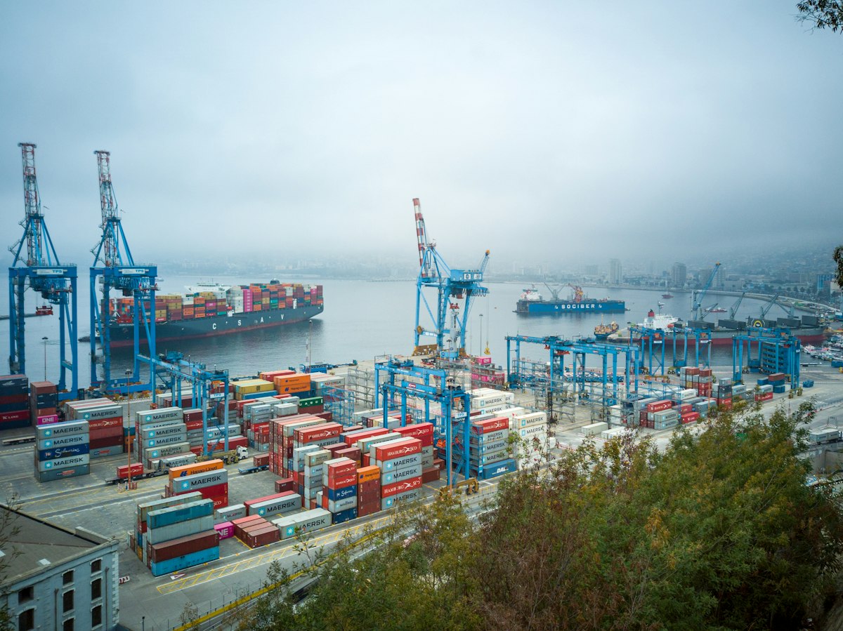 Blue and red cargo ship on the water